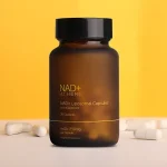 Premium liposomal NAD+ supplement bottle displayed on a yellow background for daily cellular health support.
