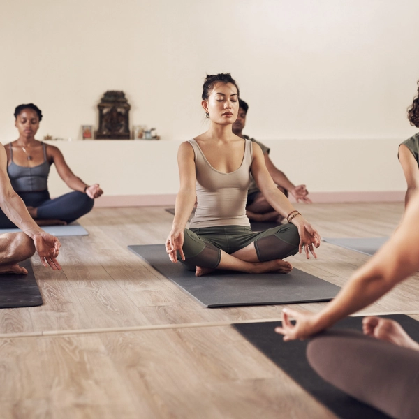 Can NAD+ Help With Weight Loss? A woman in pilates class