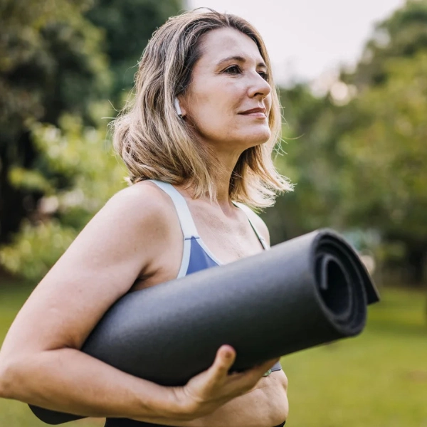 How to slow biological ageing. A woman on her way to pilates