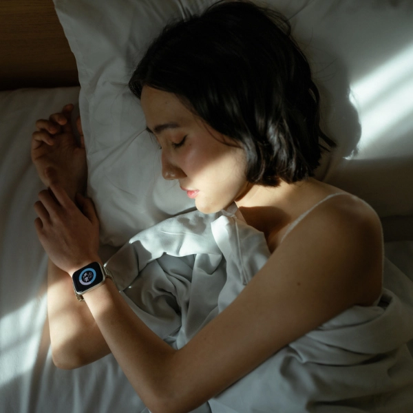 Biohacking Basics for Beginners. A woman sleep tracking with watch