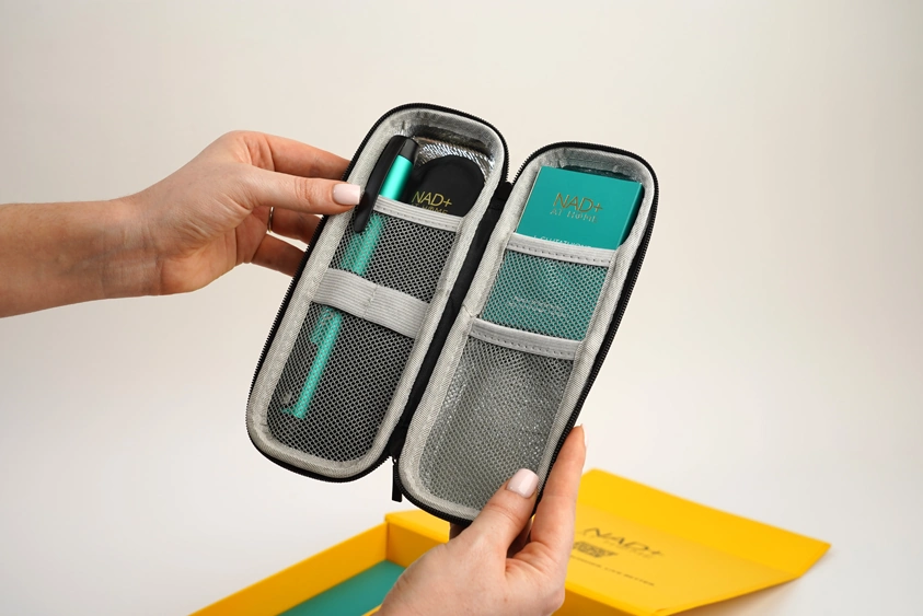 person holding the free travel case you get with the lglutathione home injection pen kit and with it open showing how it comes