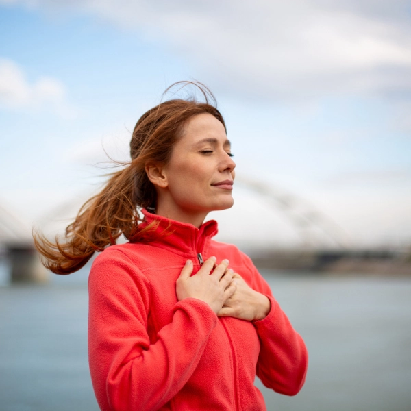 Reset your nervous system. A woman practicing breathing technique