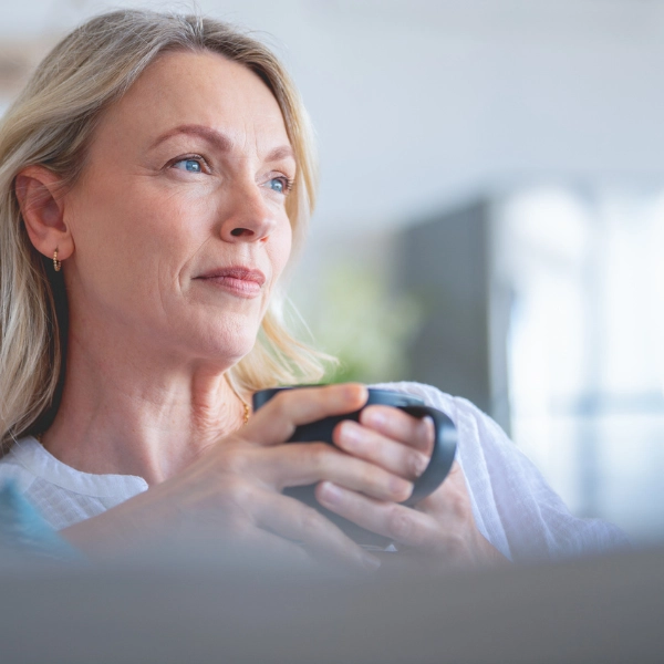 Can NAD+ Help With Perimenopause? A woman sat with a cup of tea