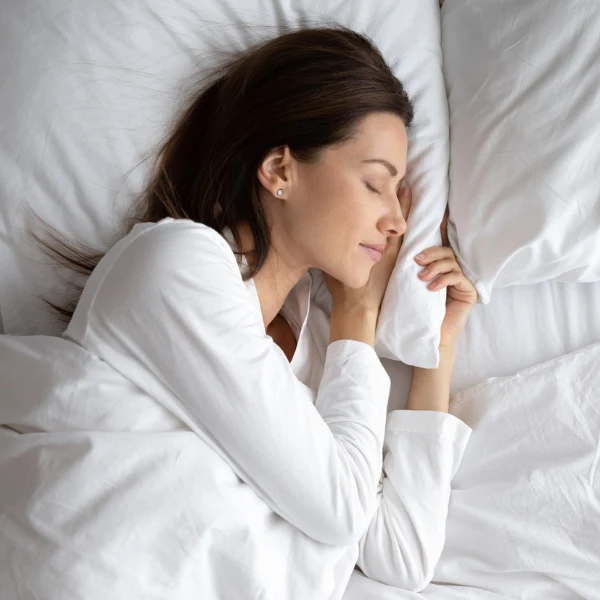 woman getting healthy hours of sleep